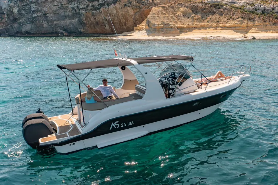 AS Marine 28 WA anchored in a turquoise cove with guests on board