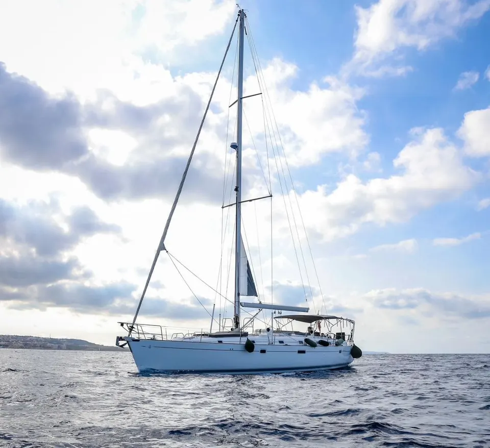 Beneteau 50 sailing yacht under full sail off the coast of Malta